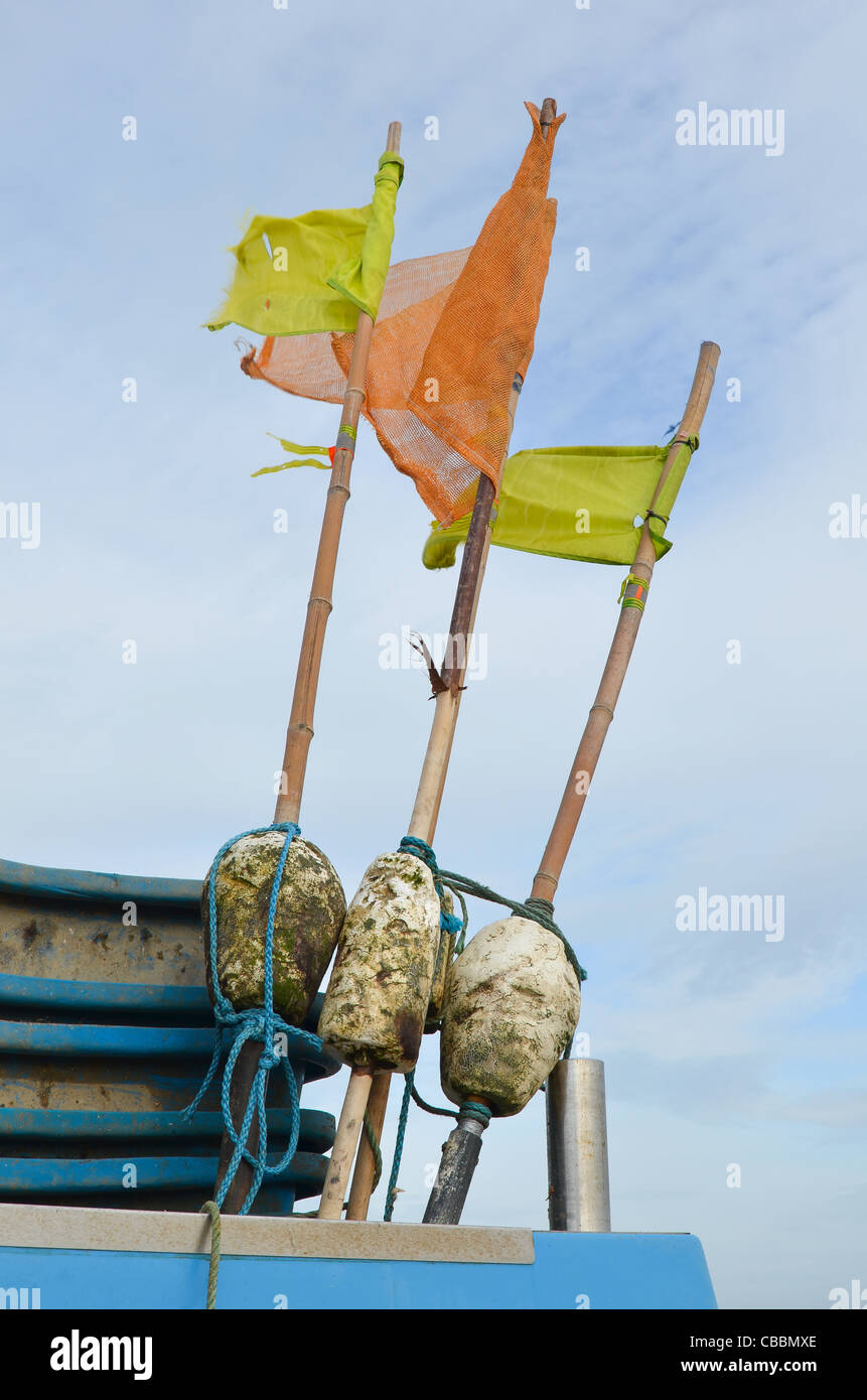 Fishing trawlers net marker floats with flags, image taken at Hythe in Kent, UK Stock Photo