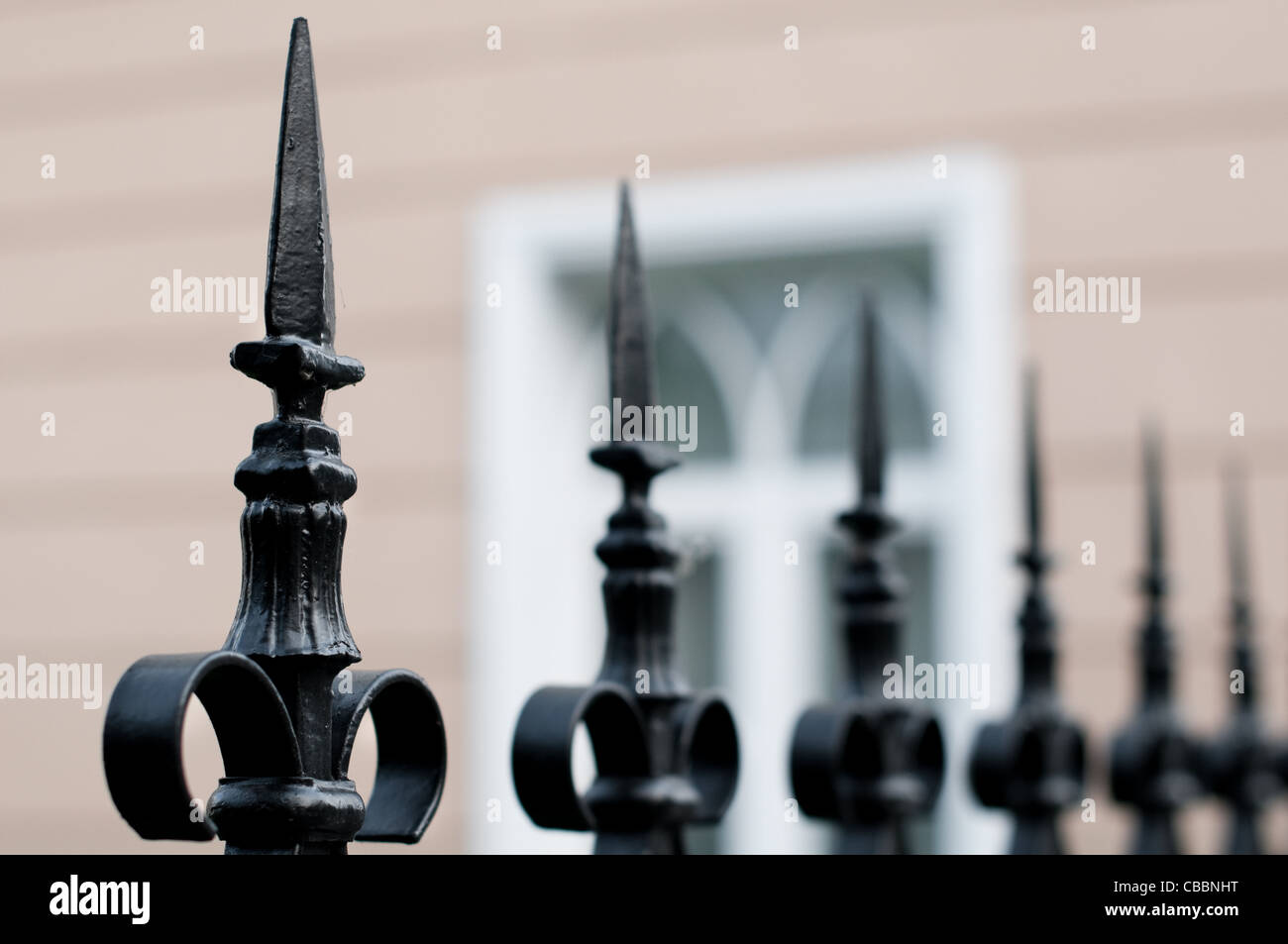 old beautiful metal fence with building in background Stock Photo - Alamy