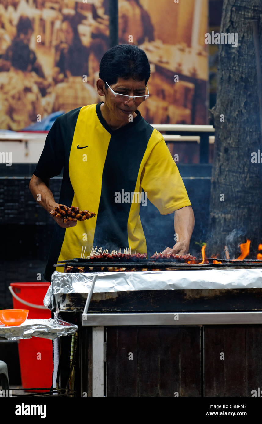 Hawker cooking satay  at a stall in Lau PA Sat, Singapore Stock Photo