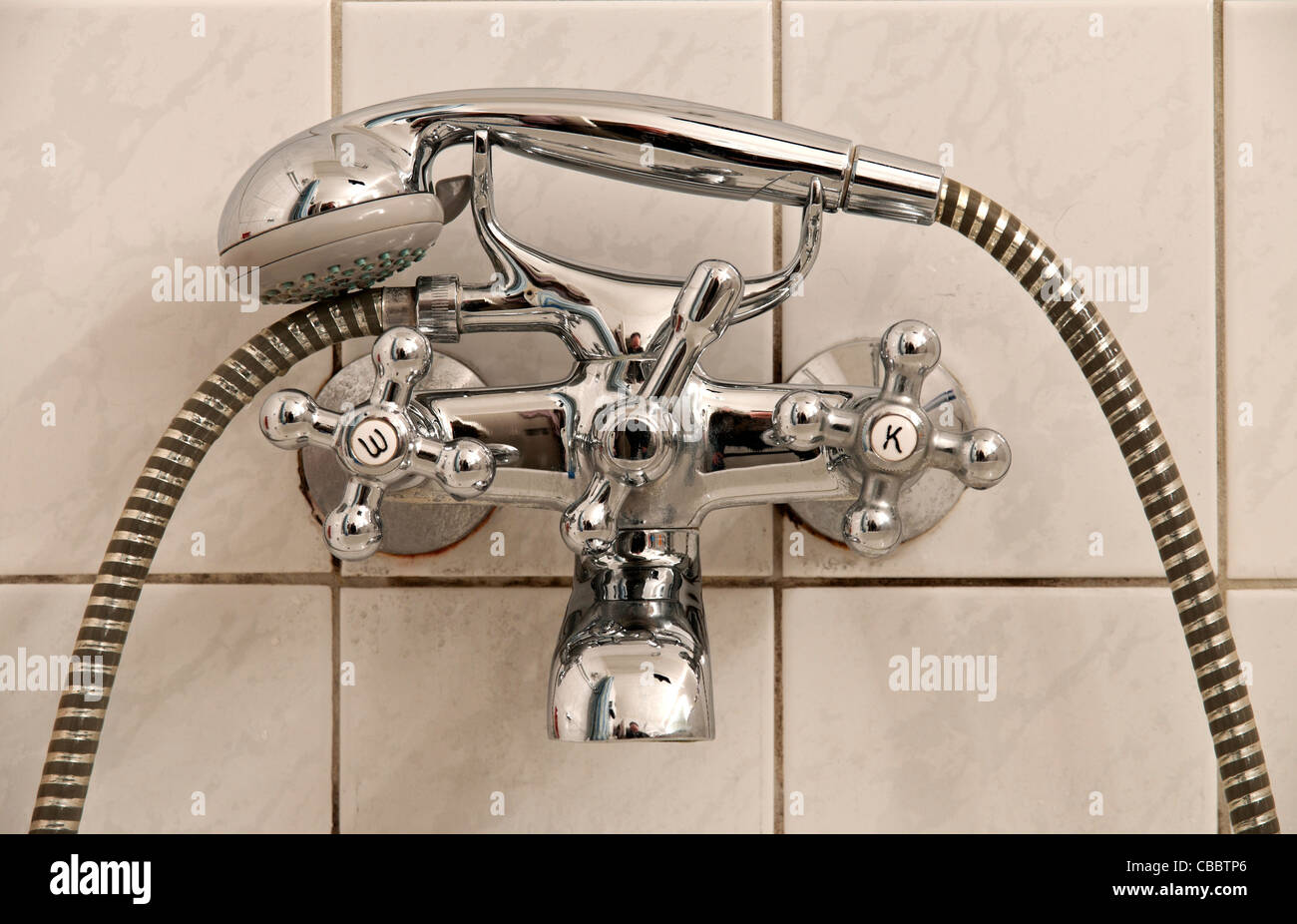 Bathroom mixer tap warm & kalt, with shower head, Germany. Stock Photo