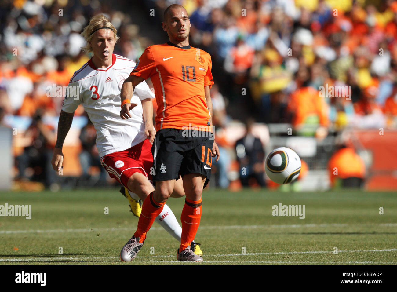 Simon Kjaer of Denmark (L) in action against Wesley Sneijder of Holland (R) during a 2010 FIFA World Cup match. Stock Photo