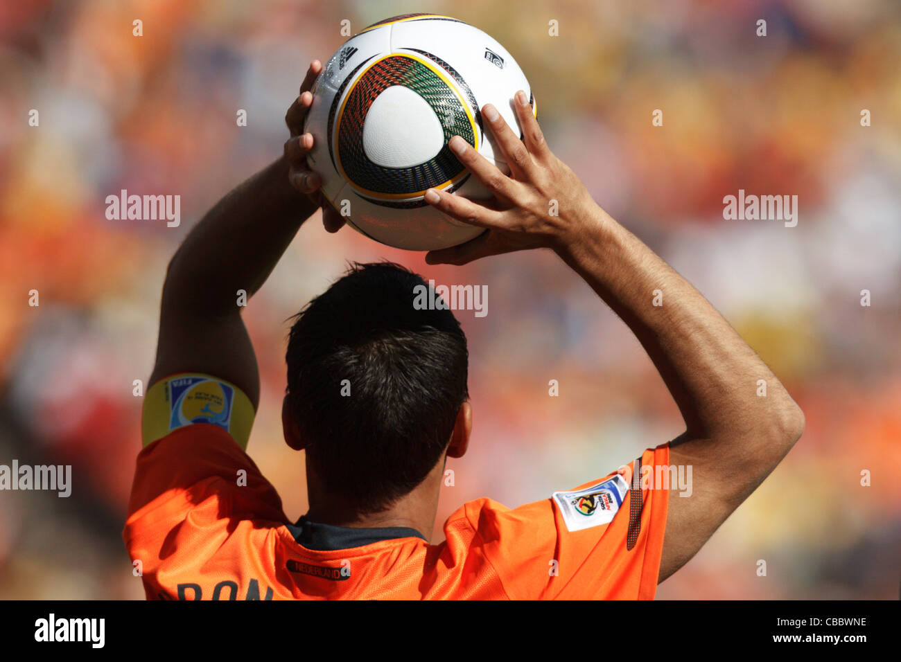 Giovanni van Bronckhorst sets to throw the ball into play during a 2010 FIFA World Cup match against Denmark. Stock Photo
