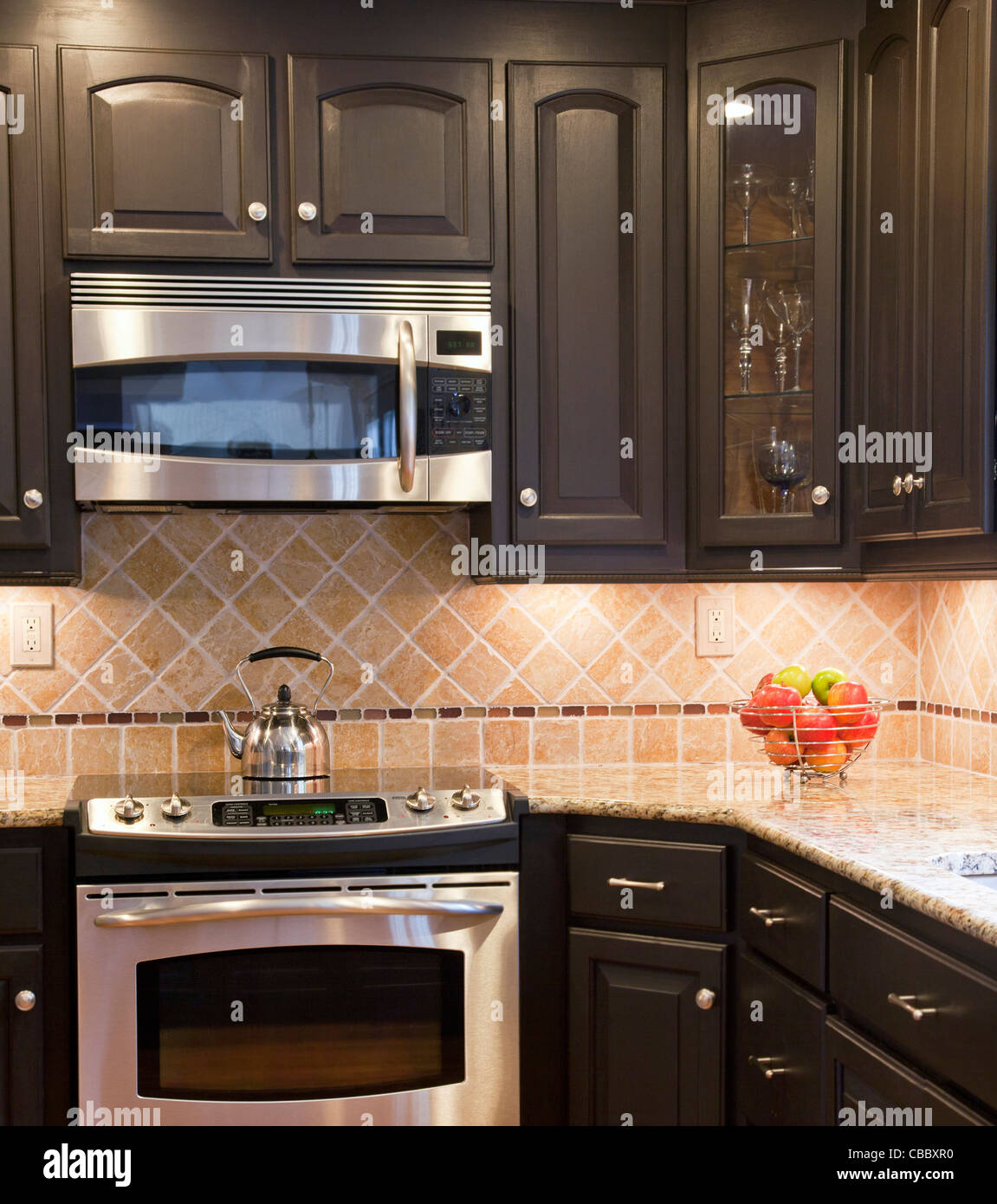 Modern Kitchen With Dark Brown Wooden Cabinets Stock Photo - Alamy