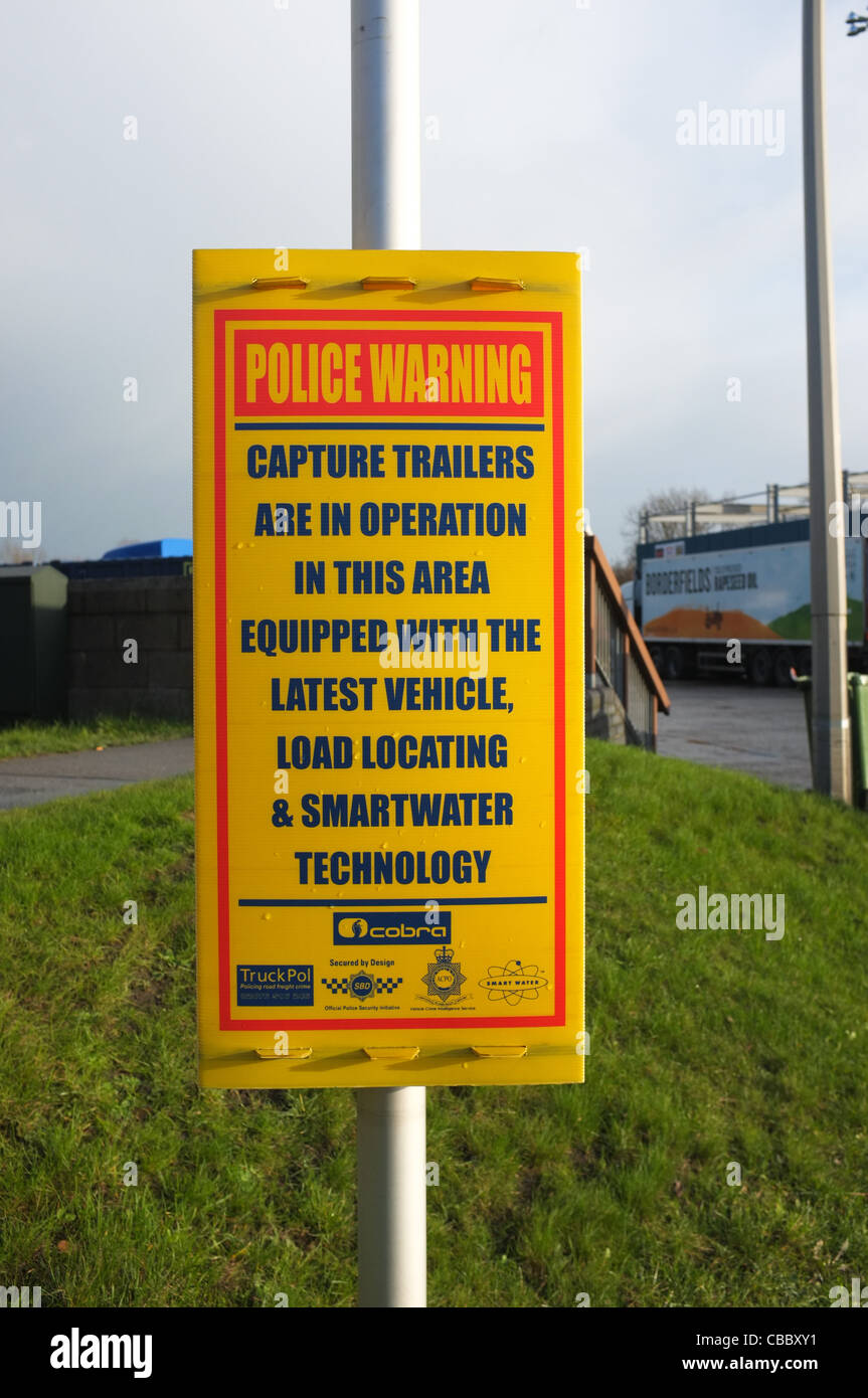Police Warning Sign at a Truck Stop warning that Capture Trailers with load locating & smartwater technology are in operation Stock Photo