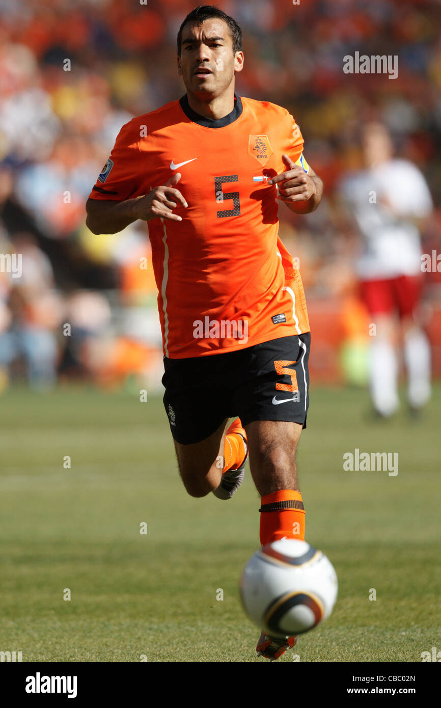Giovanni van Bronckhorst of the Netherlands runs for the ball during a 2010 FIFA World Cup match against Denmark. Stock Photo