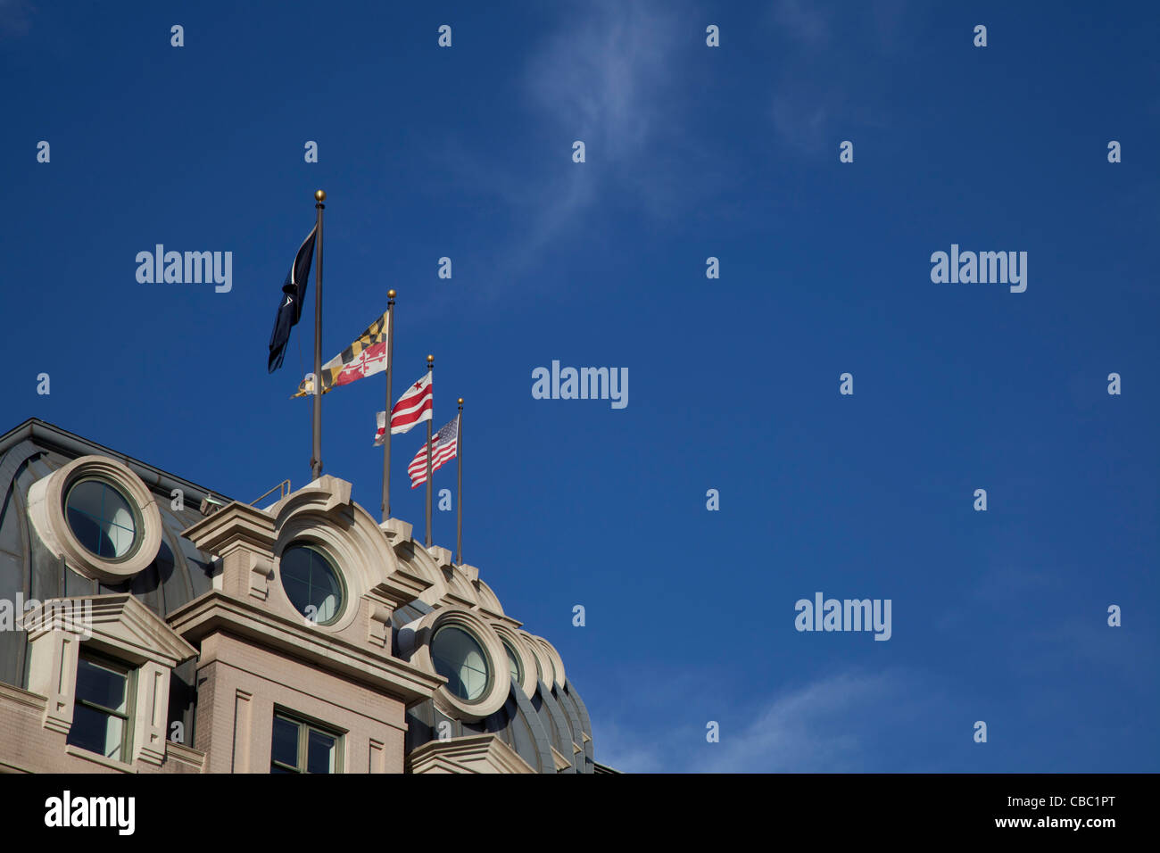 Washington, DC - Flags atop the Willard InterContinental Hotel, a luxury hotel around the corner from the White House. Stock Photo