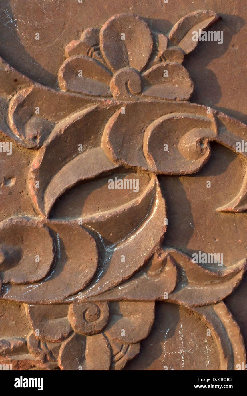 Floral motif red sandstone, Agra Red Fort India Ornate Elaborate Architecture Stock Photo