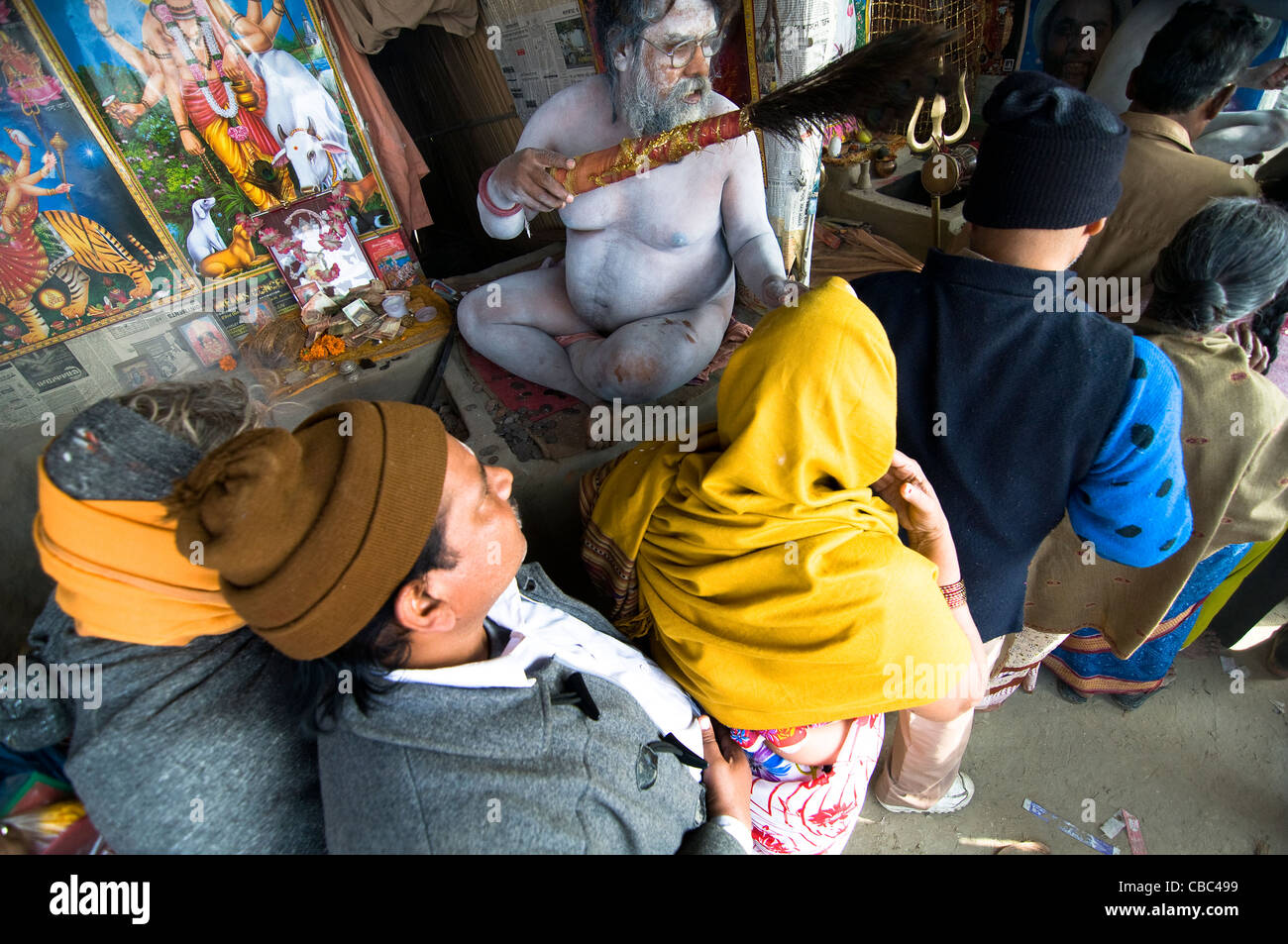 A Naga Sadhu blesses pilgrims visiting the Gangasagar mela in West Bengal, India. Stock Photo