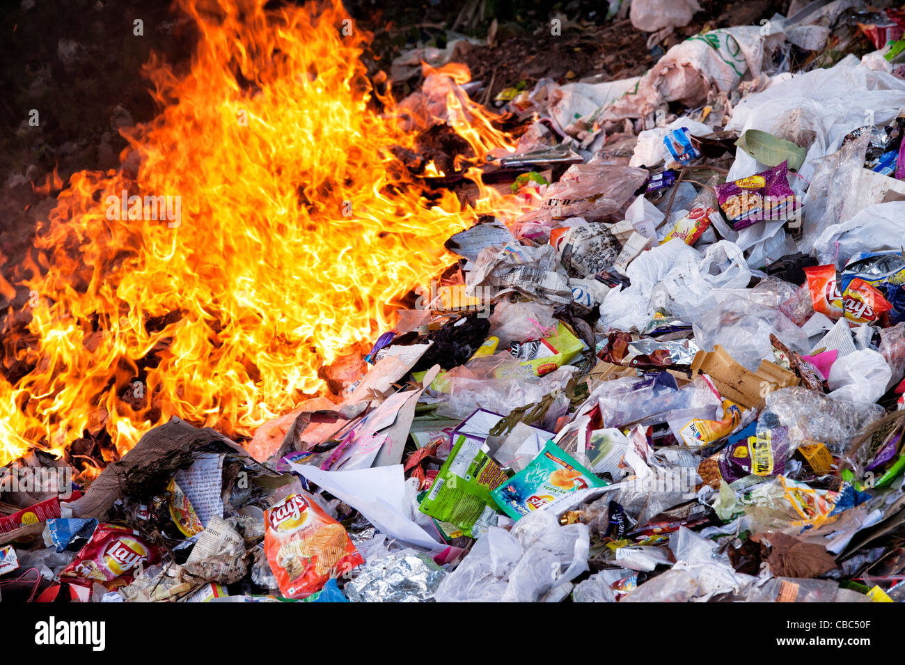 Burning household waste in the indian countryside Stock Photo