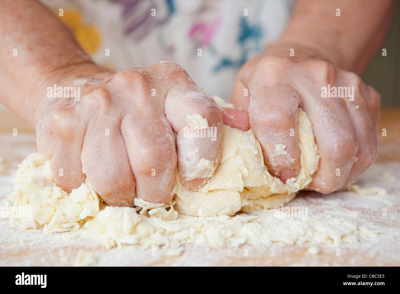 Close up of older woman kneading dough Stock Photo - Alamy