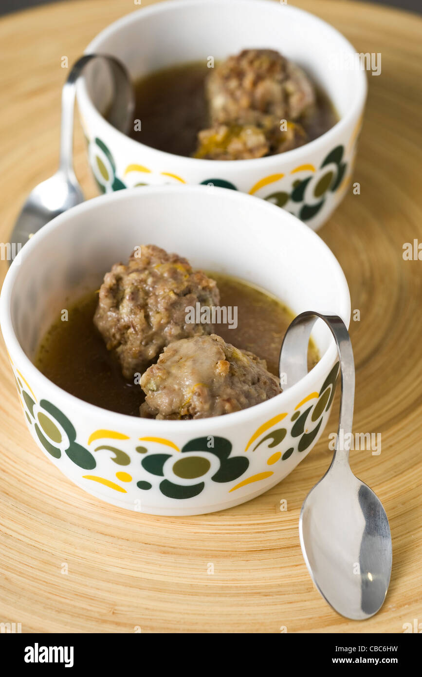 Poached meatballs with sage and lemon Stock Photo