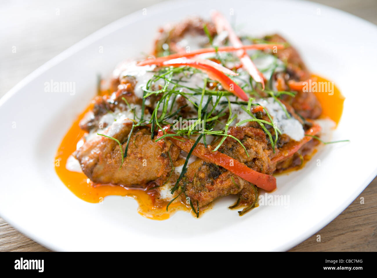 Fish with red curry sauce Stock Photo