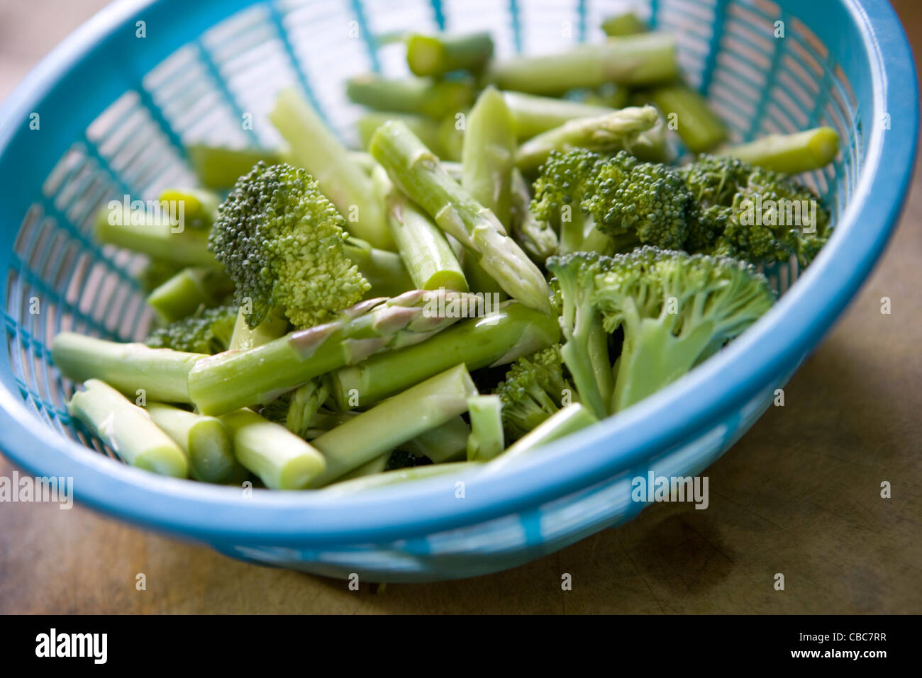 Raw broccoli florets and green asparagus Stock Photo