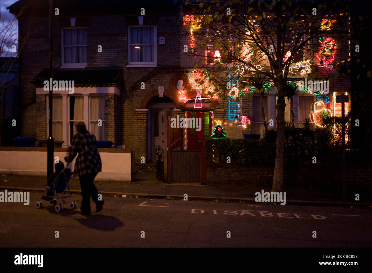 A residential houseis adorned with a mass of wasteful Christmas lights