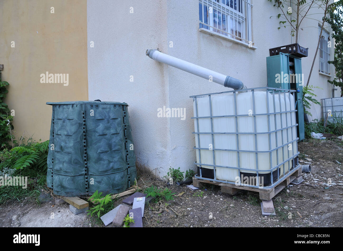 Water shortage. Household waste water is collected and reused for irrigation Stock Photo