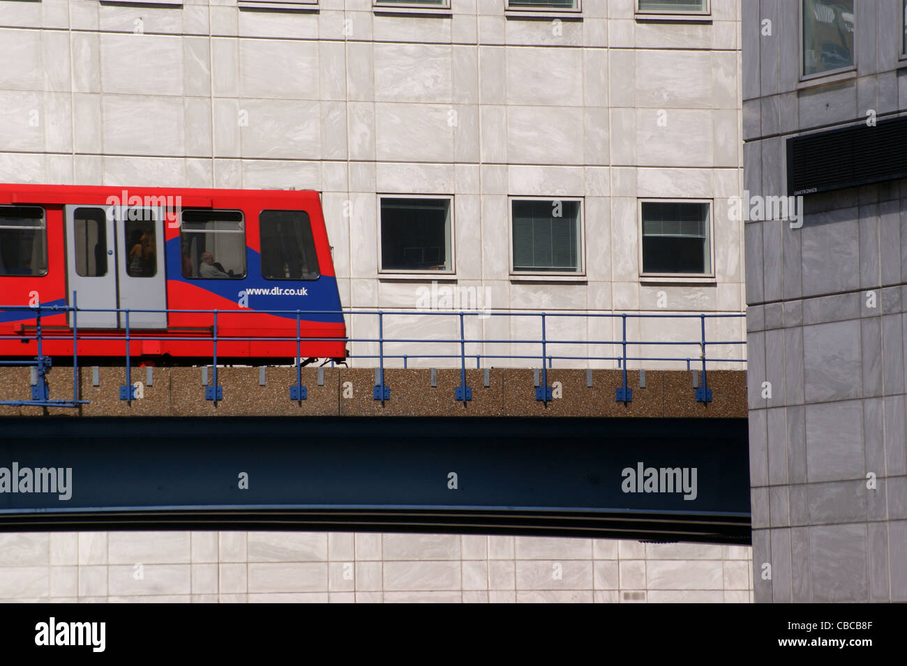 DLR Docklands Light railway train on an elevated track, Canary Wharf, Docklands, London, England Stock Photo