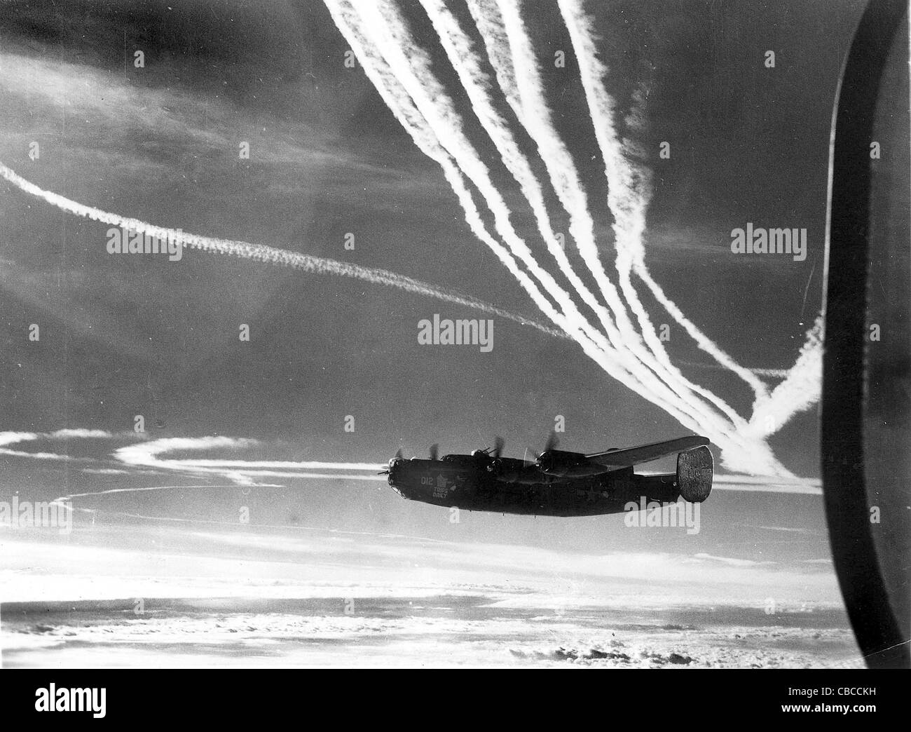 A WW11 USAAF B24 Liberator bomber at high altitude on a bombing mission over Germany. Stock Photo