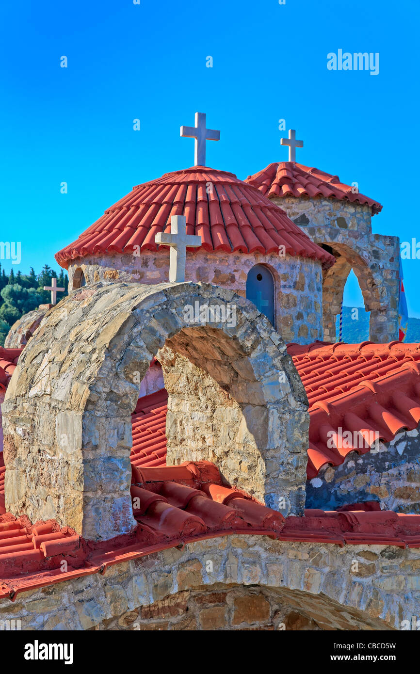 Typical stone church in Messinia, Greece, crosses and roof Stock Photo