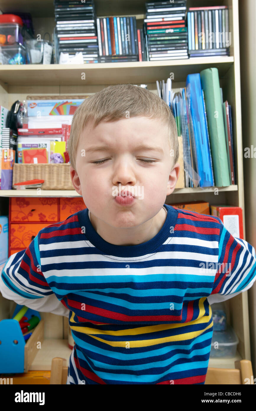young boy blowing raspberry or a kiss Stock Photo