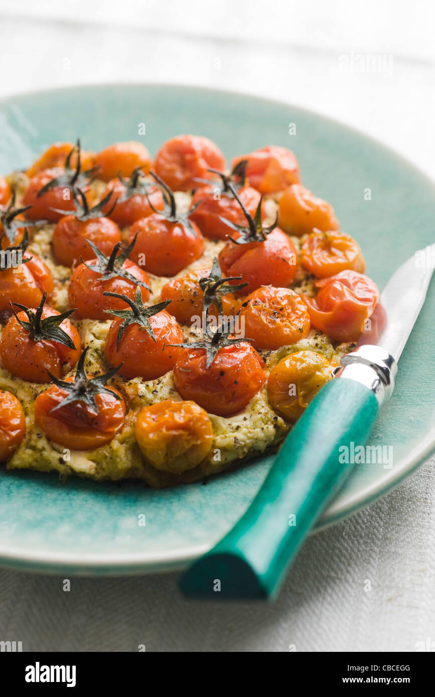 Pizza with cherry tomatoes, pesto and ricotta Stock Photo Alamy