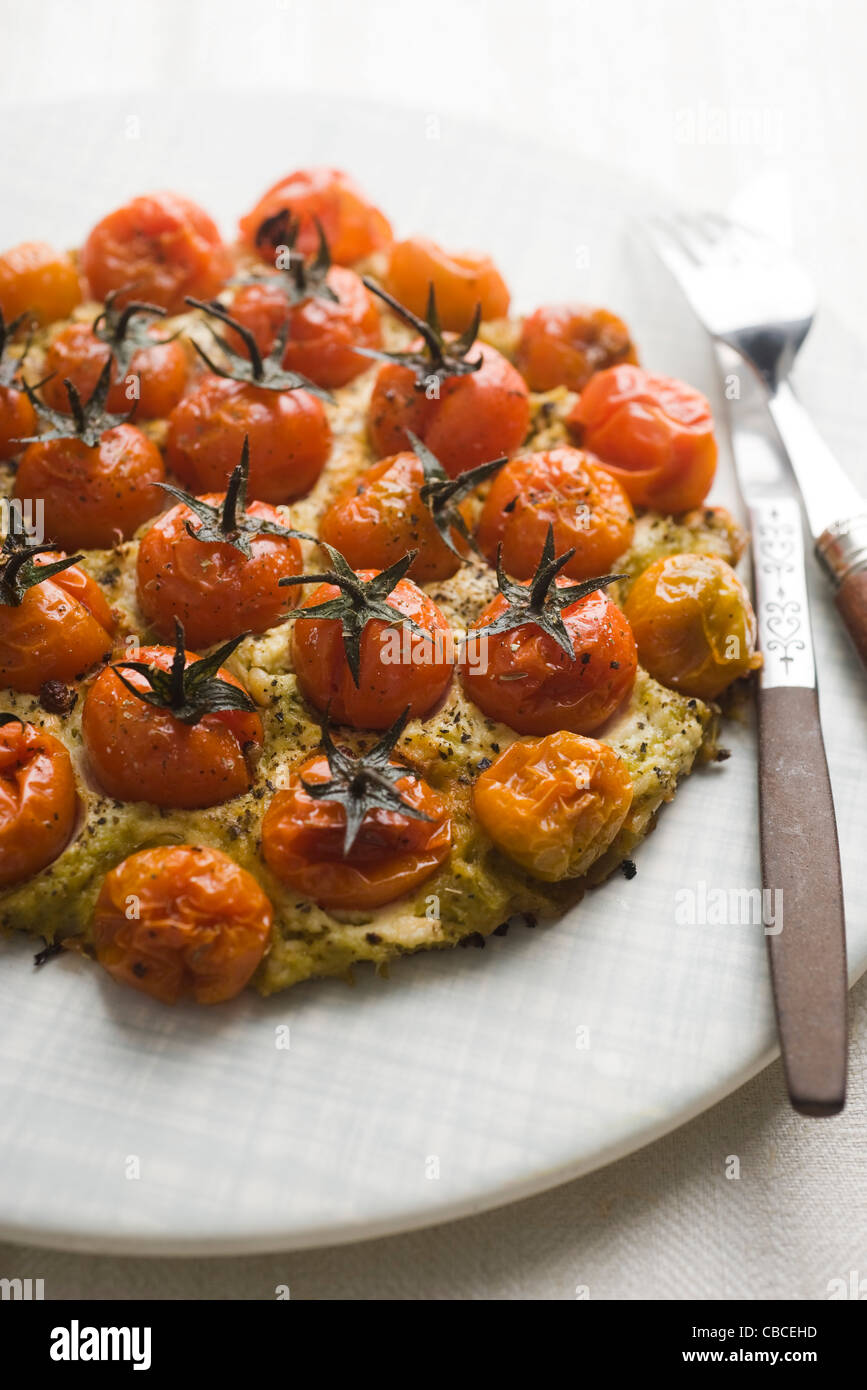 Pizza with cherry tomatoes, pesto and ricotta Stock Photo Alamy