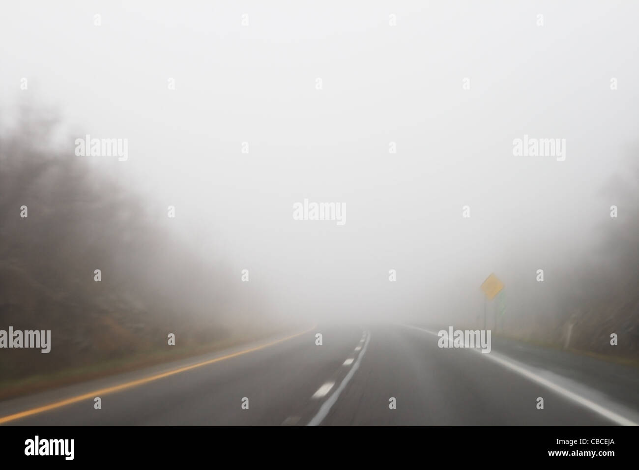 a foggy wet highway with low visibility and motion blur Stock Photo