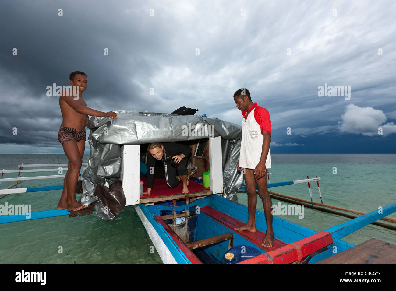 Photographer camp on Outrigger Boat, Cenderawasih Bay, West Papua, Indonesia Stock Photo
