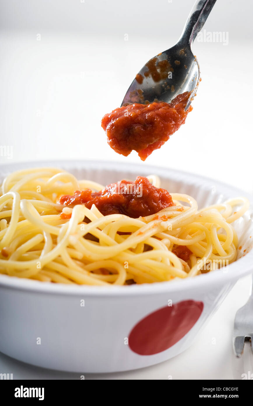 Serving tomato paste on spaghetti Stock Photo Alamy