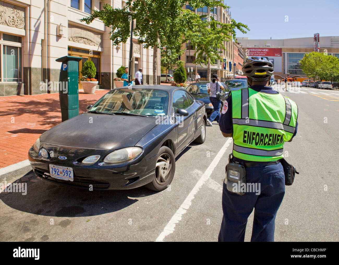 A parking enforcement writing a ticket - Washington, DC USA Stock Photo