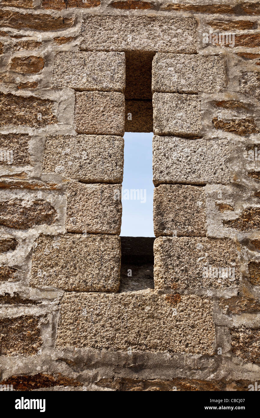 Arrowslit in castle walls Stock Photo