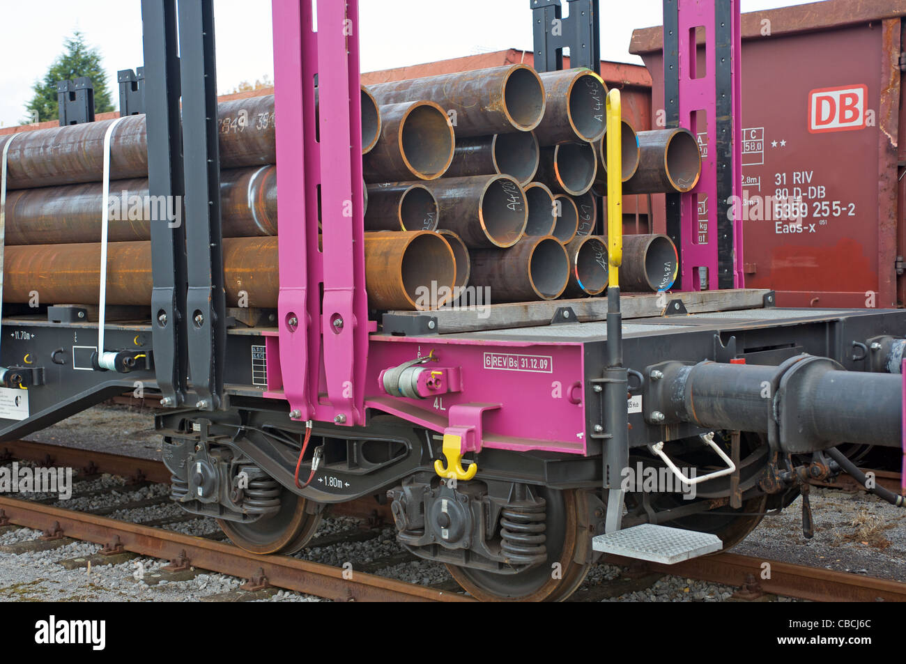 DB (German Rail) cargo train using flatbed wagons built by Transwagon of Bulgaria, Dusseldorf, Germany. Stock Photo