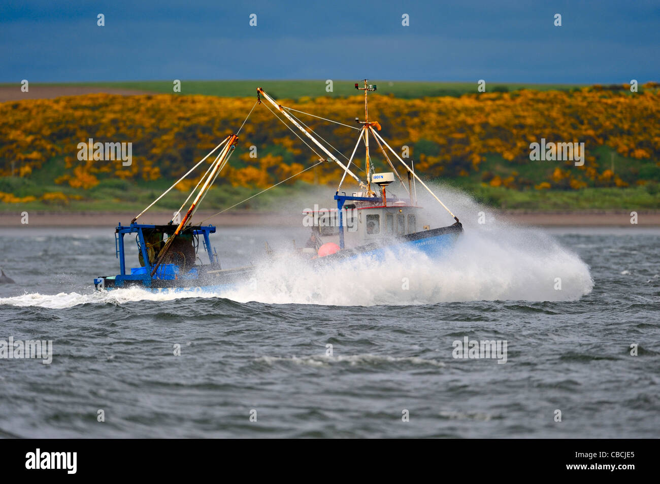 Fishing boat in rough weather in Cromarty Firth Scotland Stock Photo