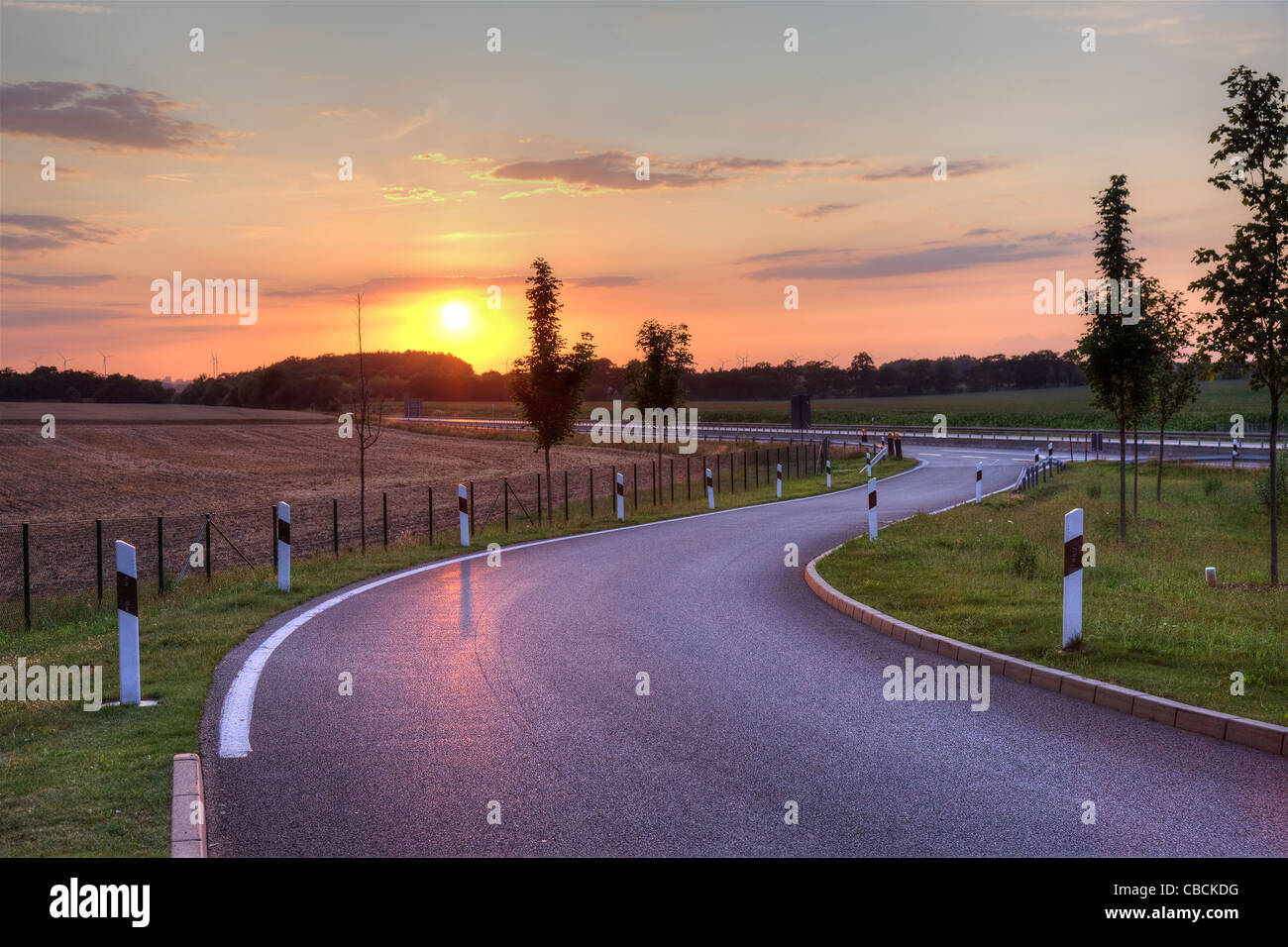 Picturesque sunset on highway in Netherlands, Europe. Stock Photo