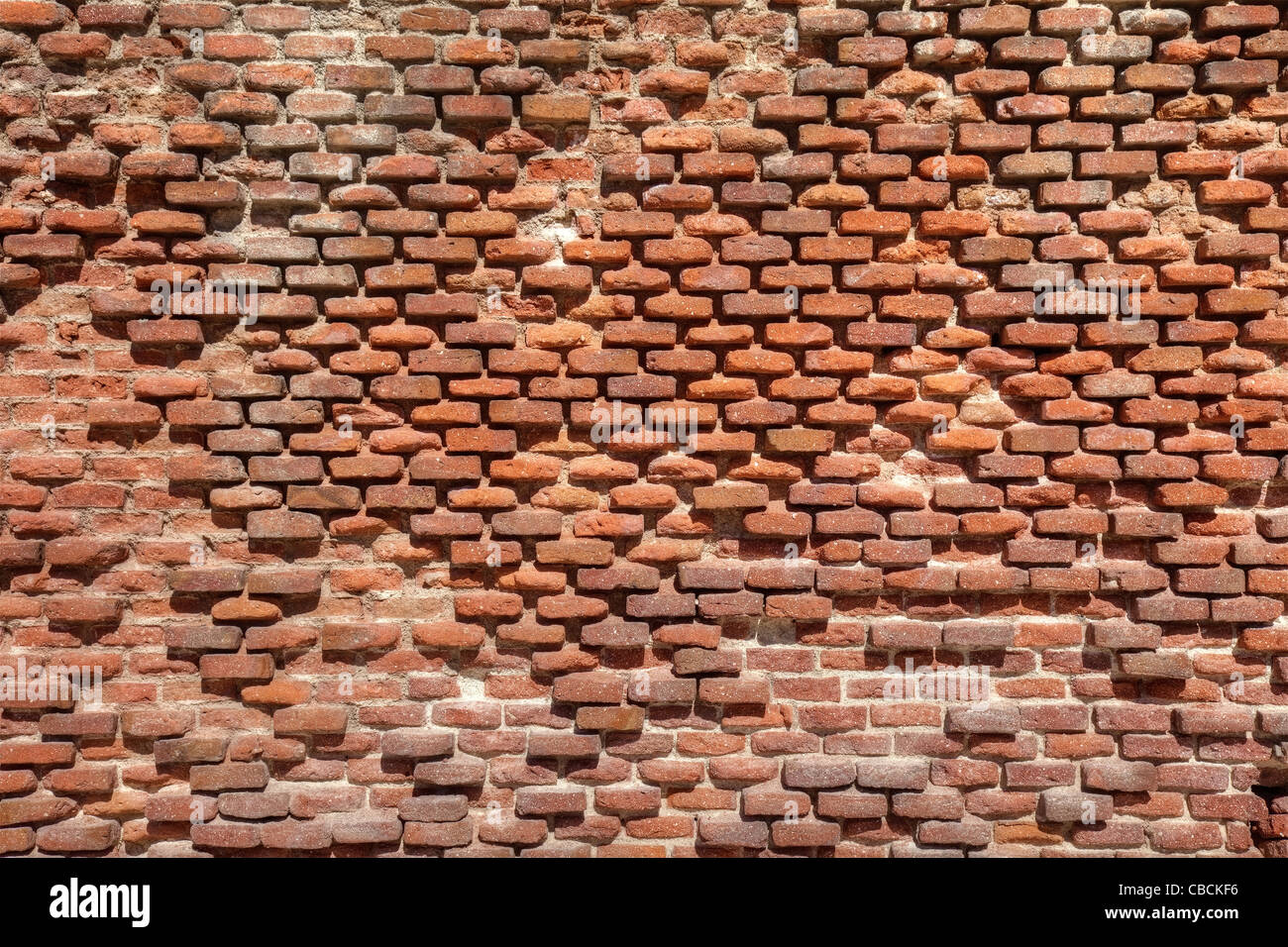 Old weathered brick wall as texture. Stock Photo