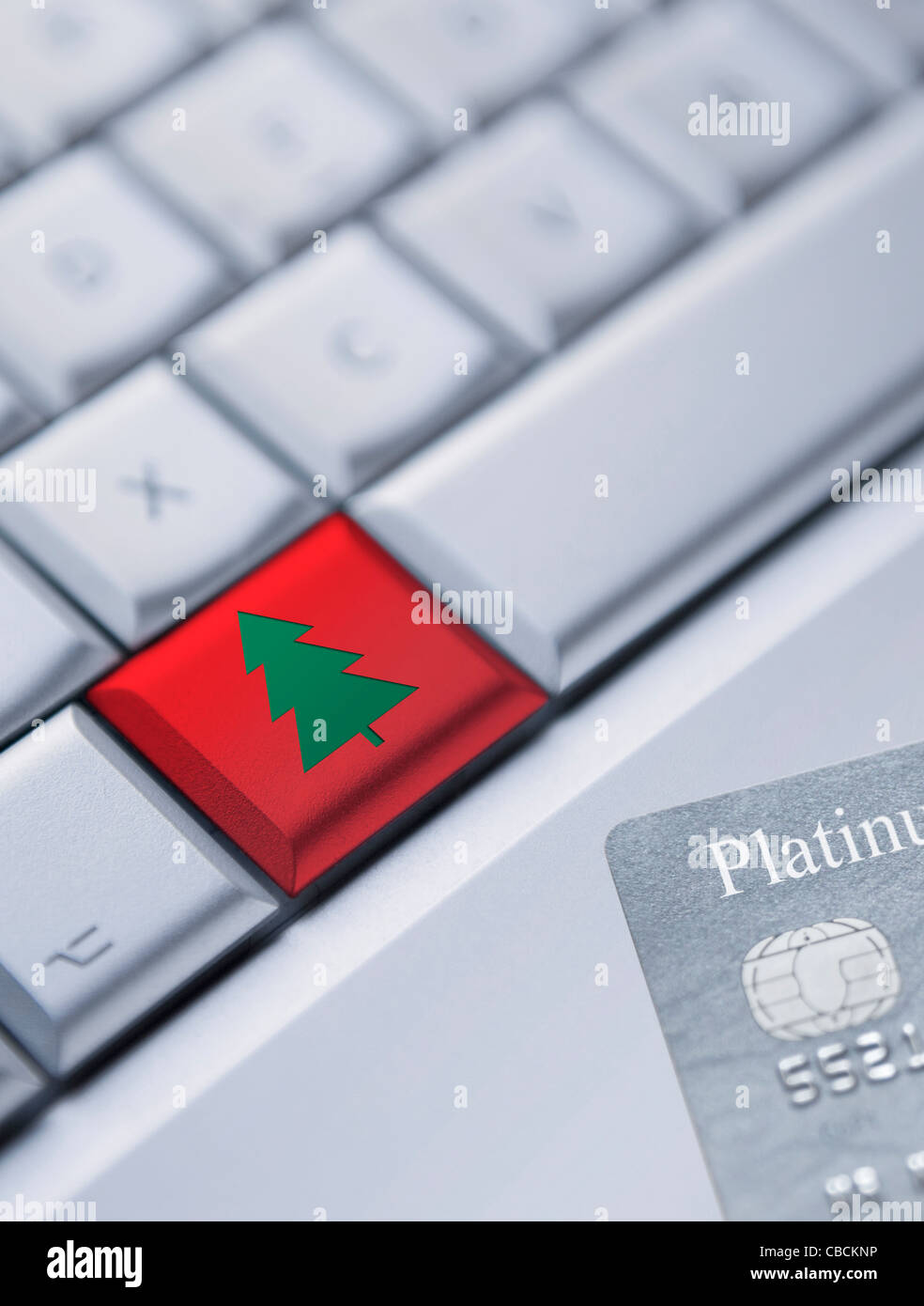 Detail of a laptop keyboard with one red key with Christmas Tree Symbol