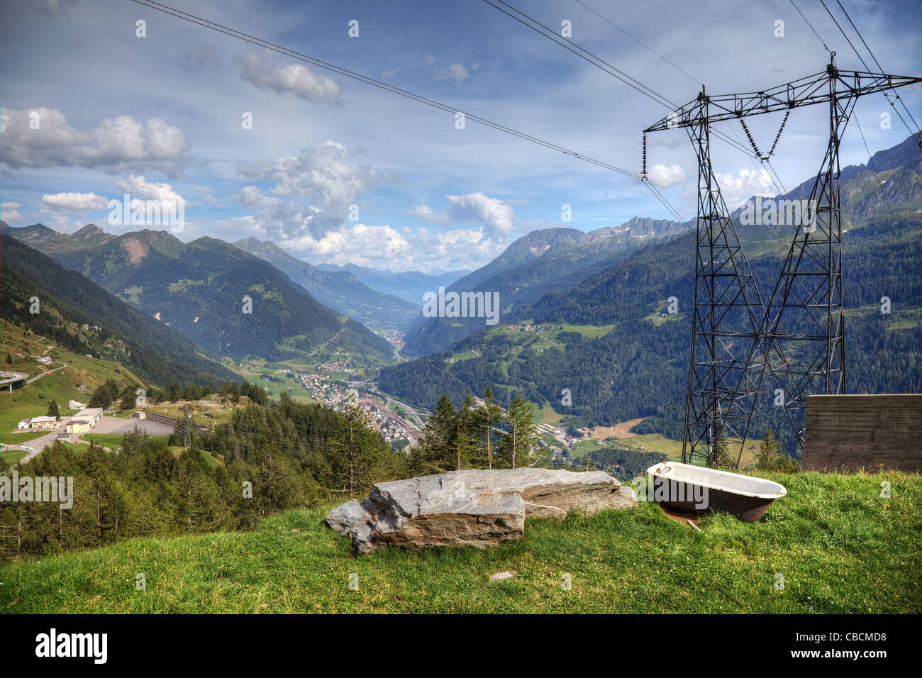 Modern aerial view of swiss alps - powerline, roads and strange bath. Stock Photo