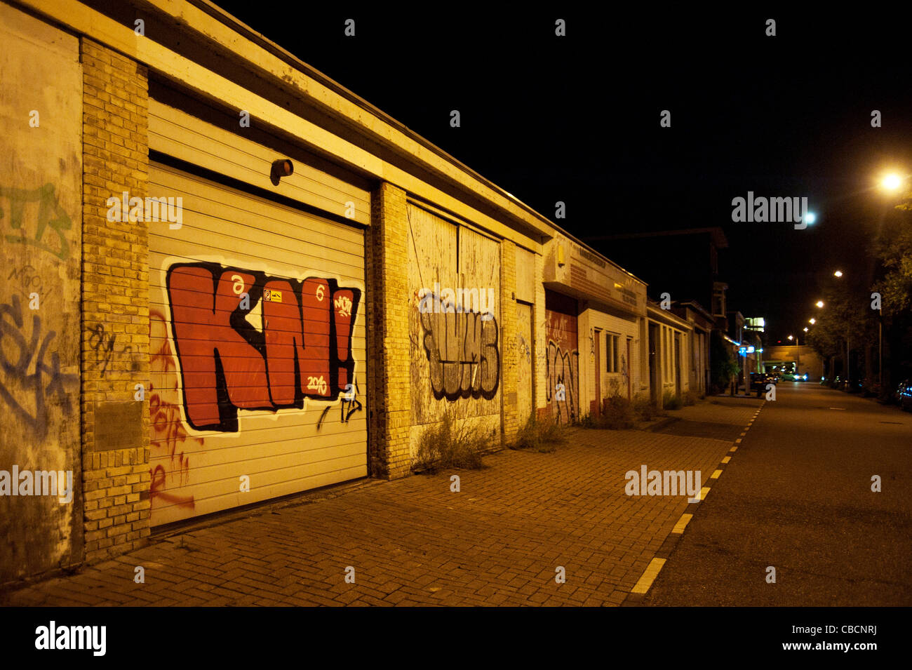 Graffiti at parking shack in dark street Amsterdam Stock Photo - Alamy