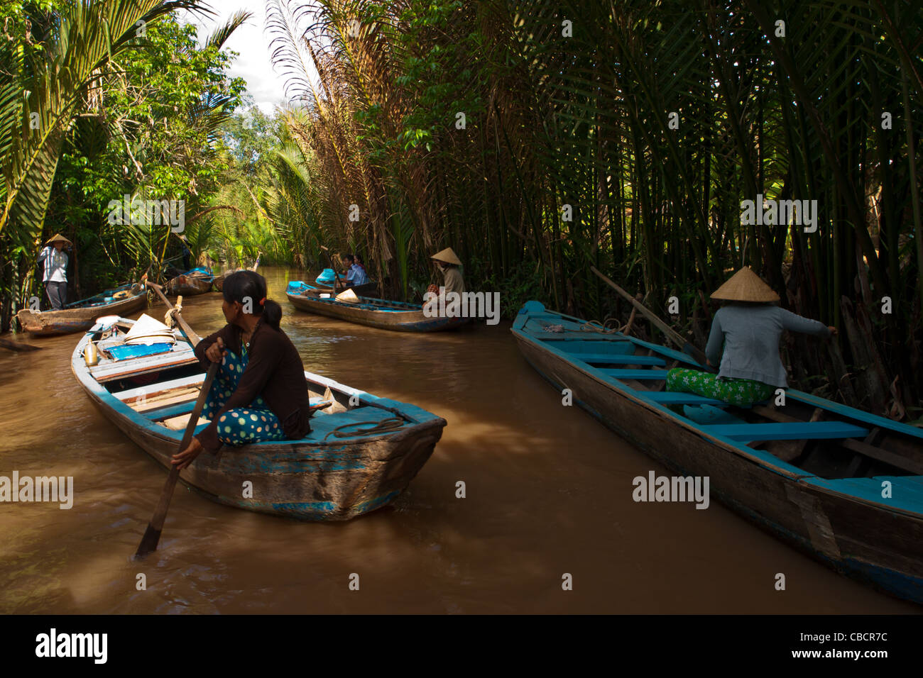 Group of boat drivers on Mekong river waiting for their customers at bee farm near Tan Thach, Ben Tre, Soutern Vietnam Stock Photo