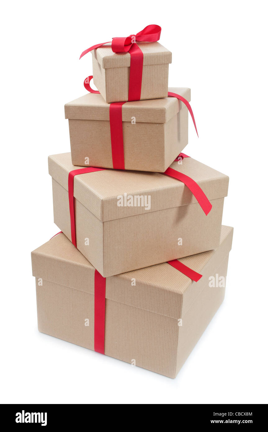Stack of gift boxes of different sizes each tied with red ribbon Stock