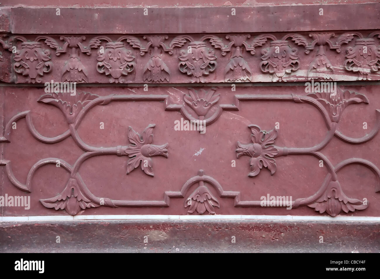 Wall panel floral motif design red sandstone fatehpur sikri Stock Photo