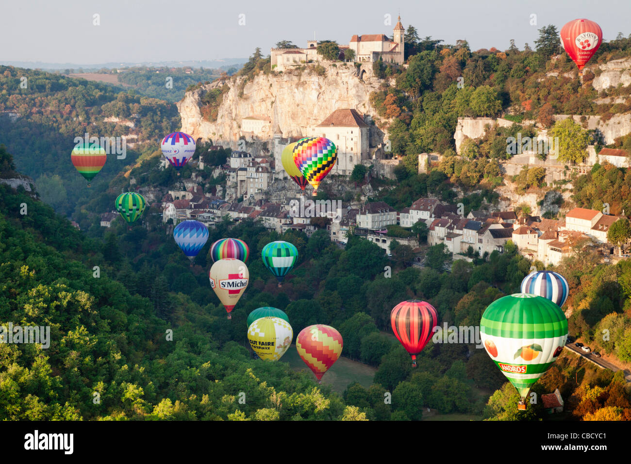 Hot air balloons rise just after dawn at Rocamadour, Midi-Pyrenees, France Stock Photo