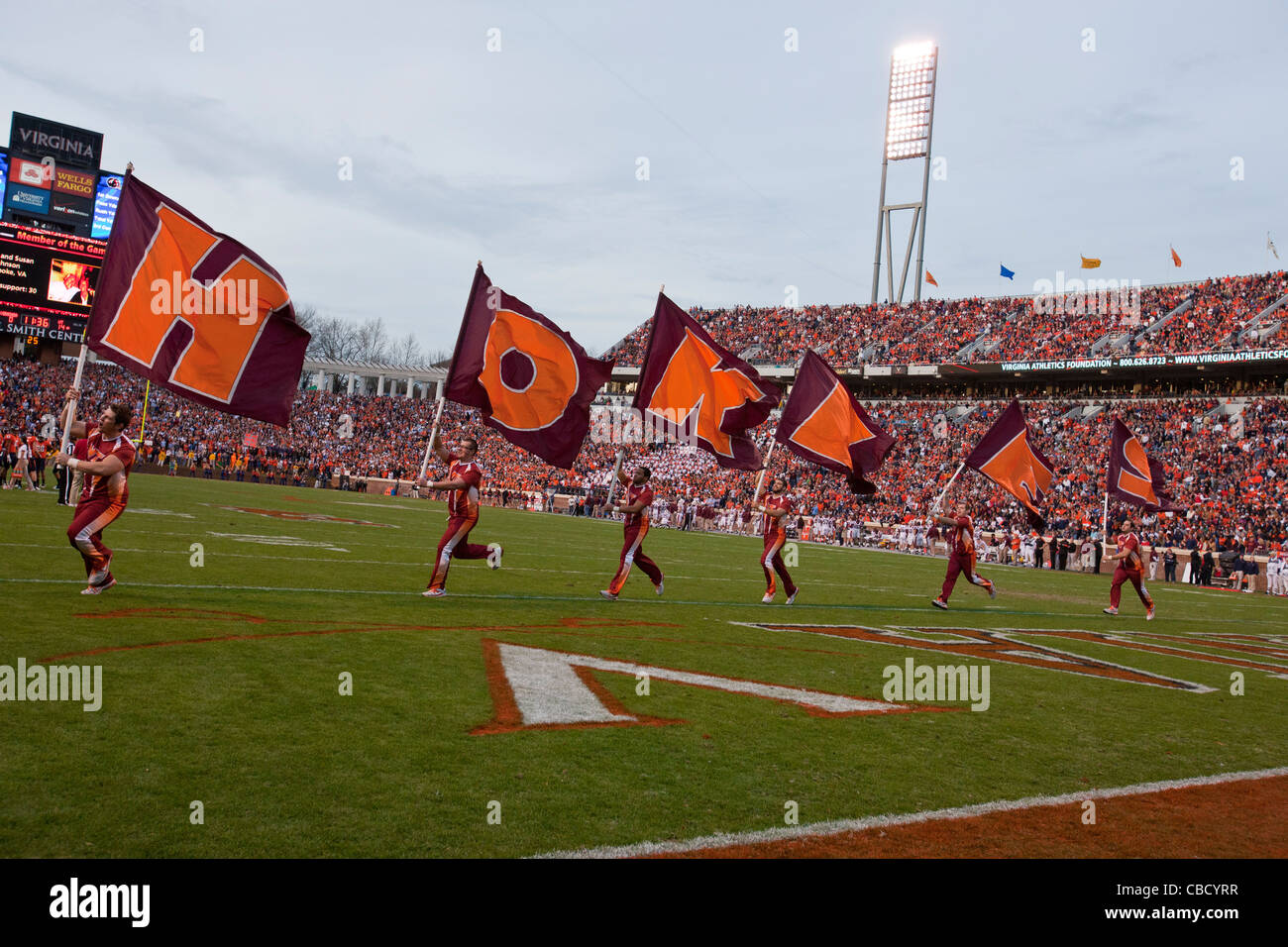 Virginia Tech Hokies cheerleaders celebrate a touchdown against the Virginia Cavaliers during the second quarter at Scott Stadium, Charlottesville, Virginia, United States of America Stock Photo