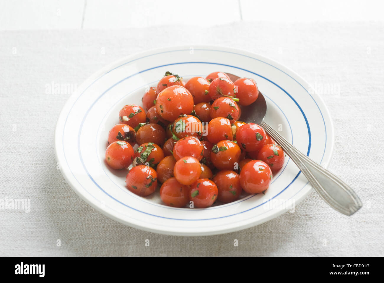 Cherry tomato confit with herbs Stock Photo Alamy