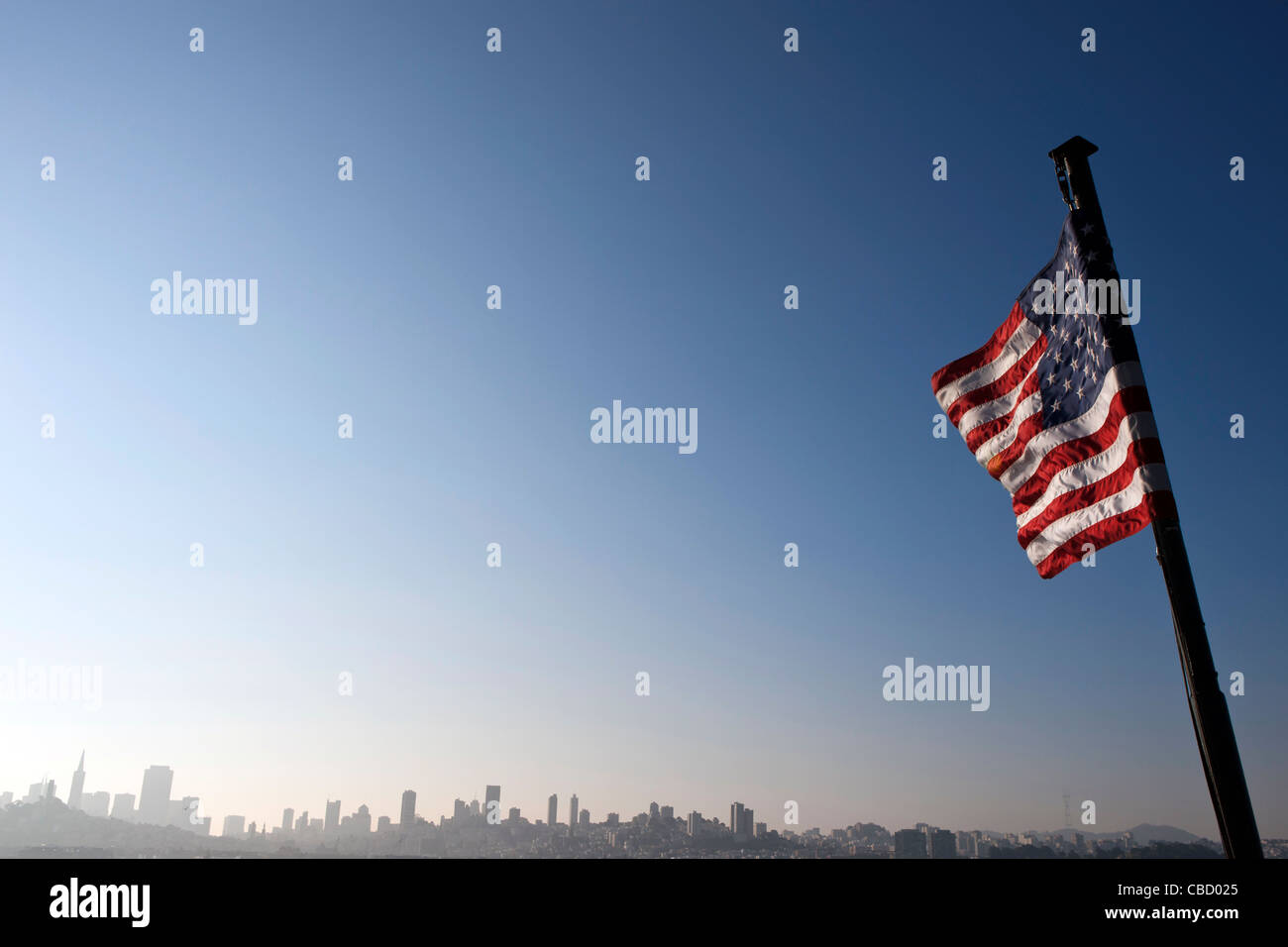 View of an American flag with San Francisco city skyline in the background, California, United States of America Stock Photo