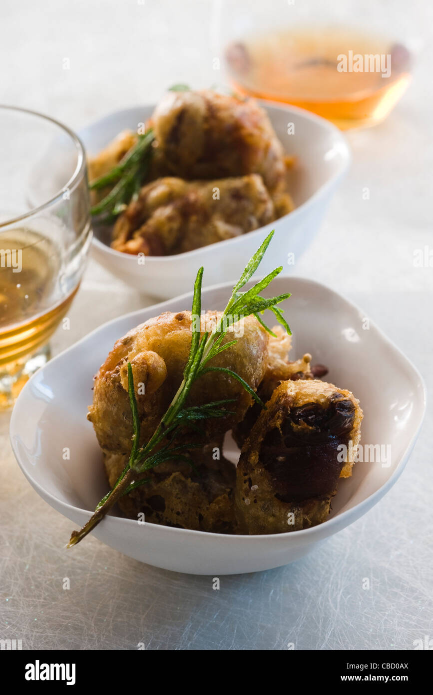 Dates covered in pancetta Stock Photo Alamy