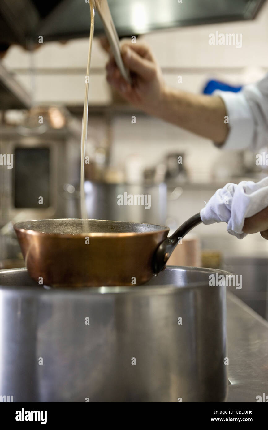 Cooking with double boiler Stock Photo