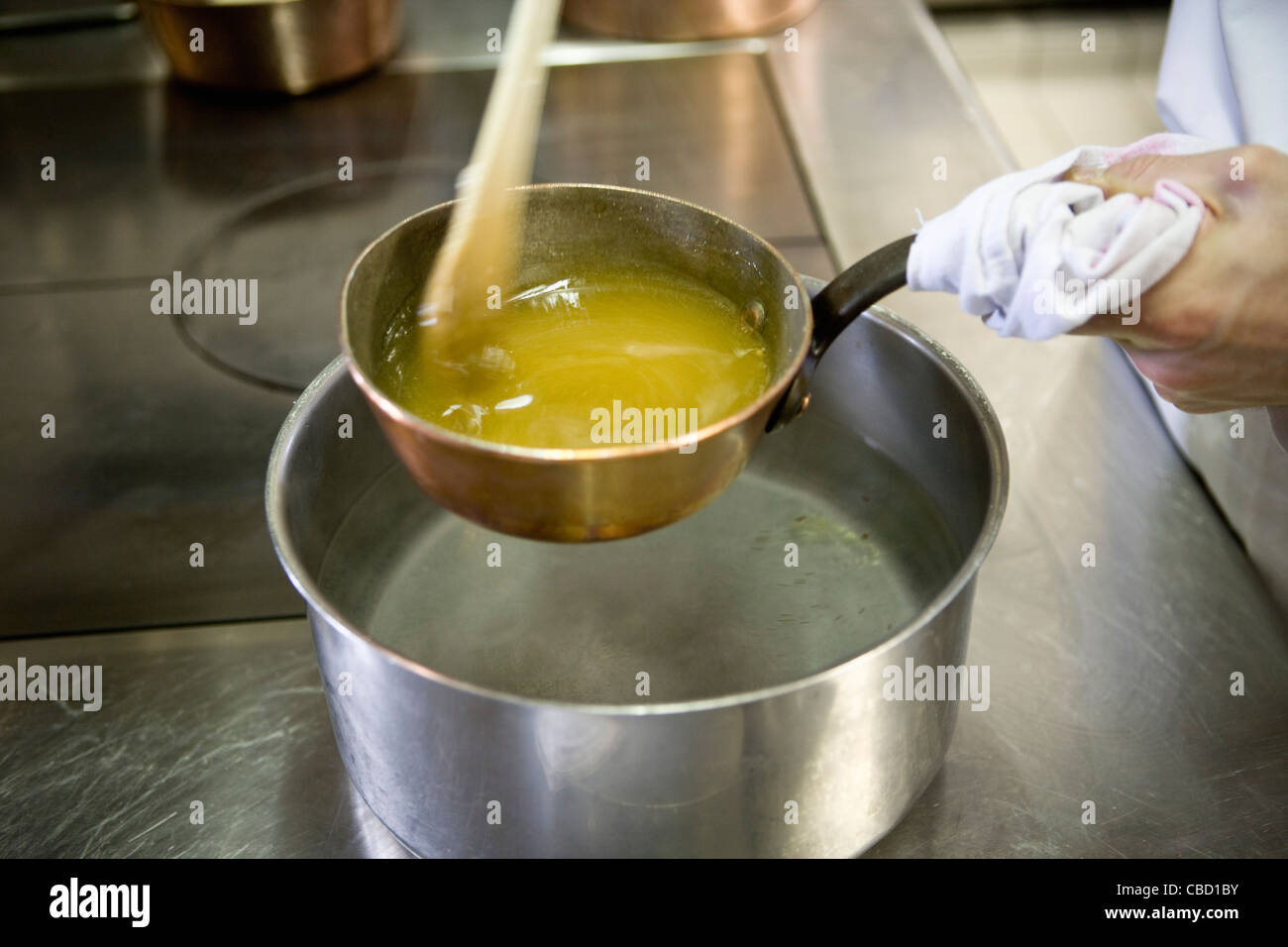 Making caramel with double boiler Stock Photo