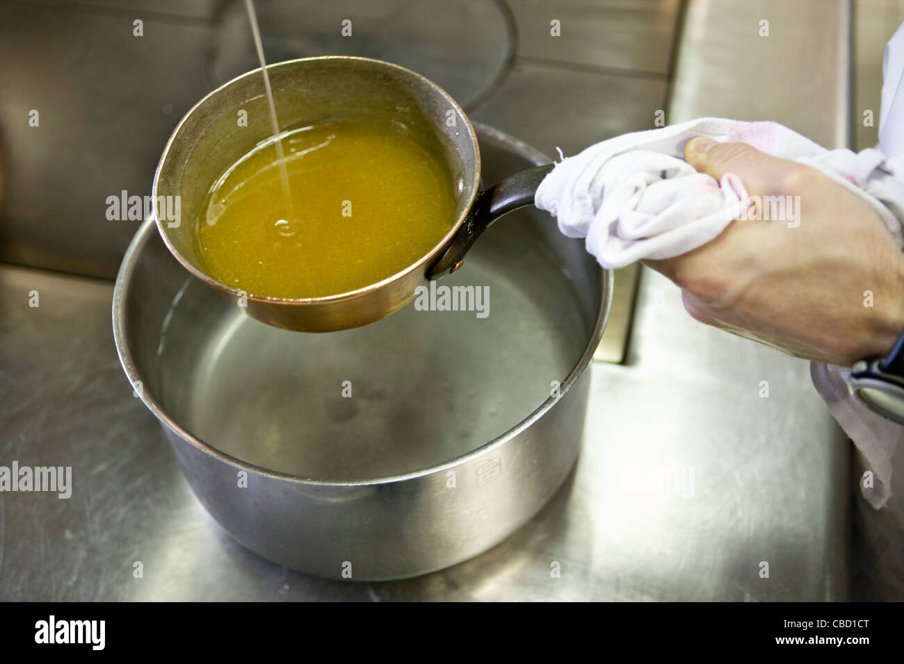 Making caramel with double boiler Stock Photo