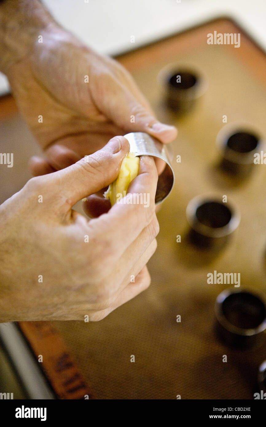 Man buttering baking mold, cropped Stock Photo Alamy