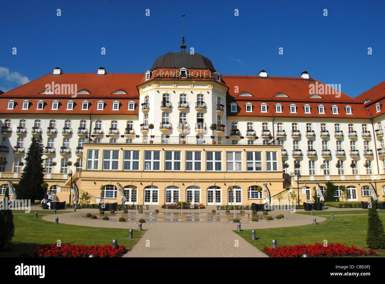 The majestic Grand Hotel at Sopot on the Baltic Sea coast near Gdansk seen from the beach and park side Stock Photo